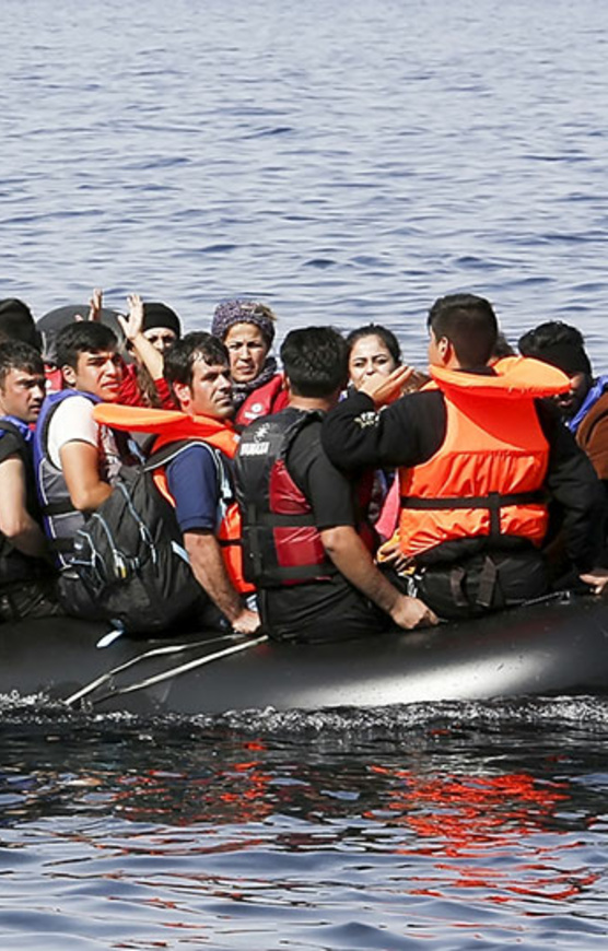 The image by Andy Aitchison shows refugees in a boat try to cross the Channel.