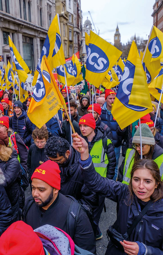 Photo of a PCS rally with yellow PCS flags
