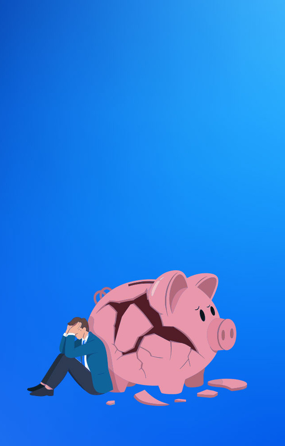 Image of man with his head in his hands next to a smashed up piggy bank