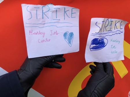 Image shows 2 hand-made placards reading "Strike Hanley Job Centre"