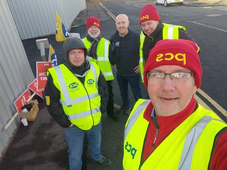 5 PCS members in high vis vests and beanie hats