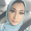 Sultana is wearing a light blue hijab